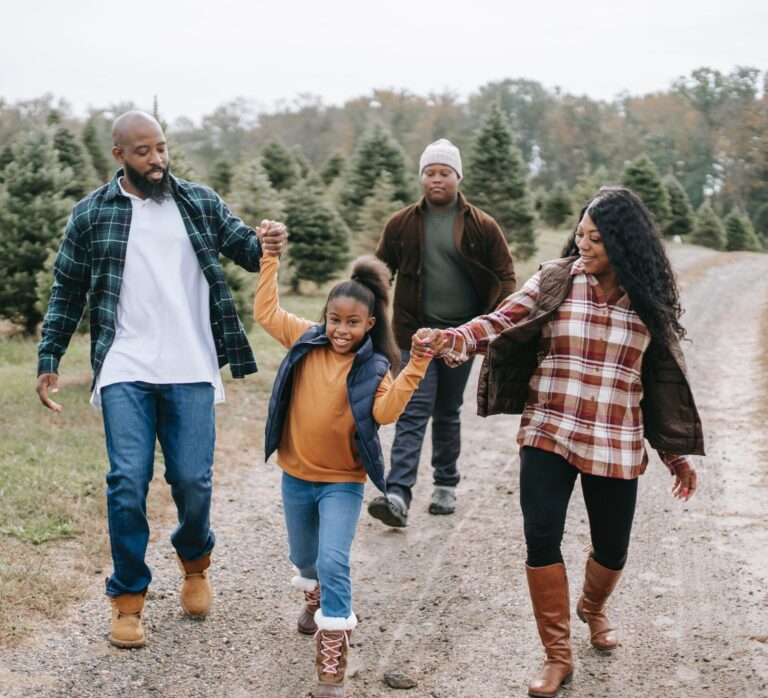 Family walking on a tree farm.