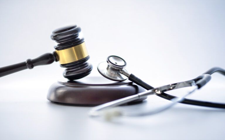 Judge gavel and stethoscope. Medical jurisprudence. Medical malpractice, lawyer