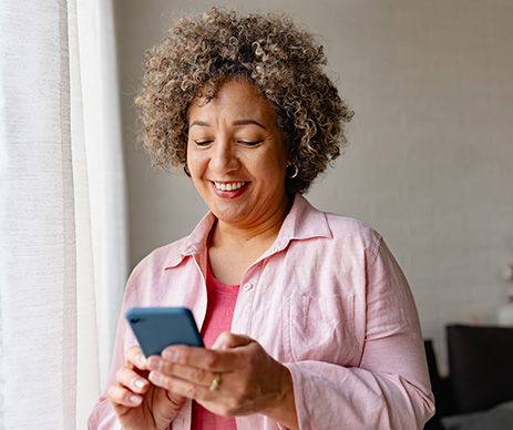 Older woman looking at phone